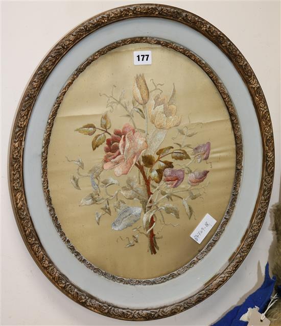 A silk embroidered circular floral panel